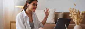 A woman focused on learning Spanish Phrases at home.